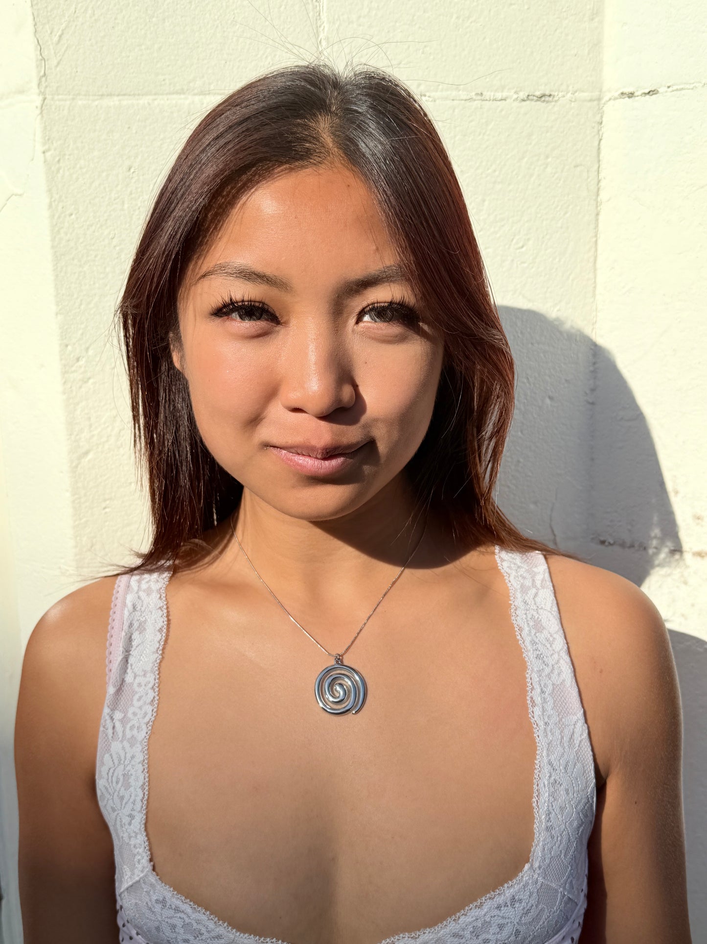 Tilly’s swirl necklace in Silver