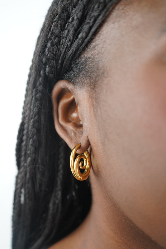 Tilly’s gold swirl earrings