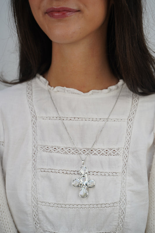 Daisy's silver cross necklaces