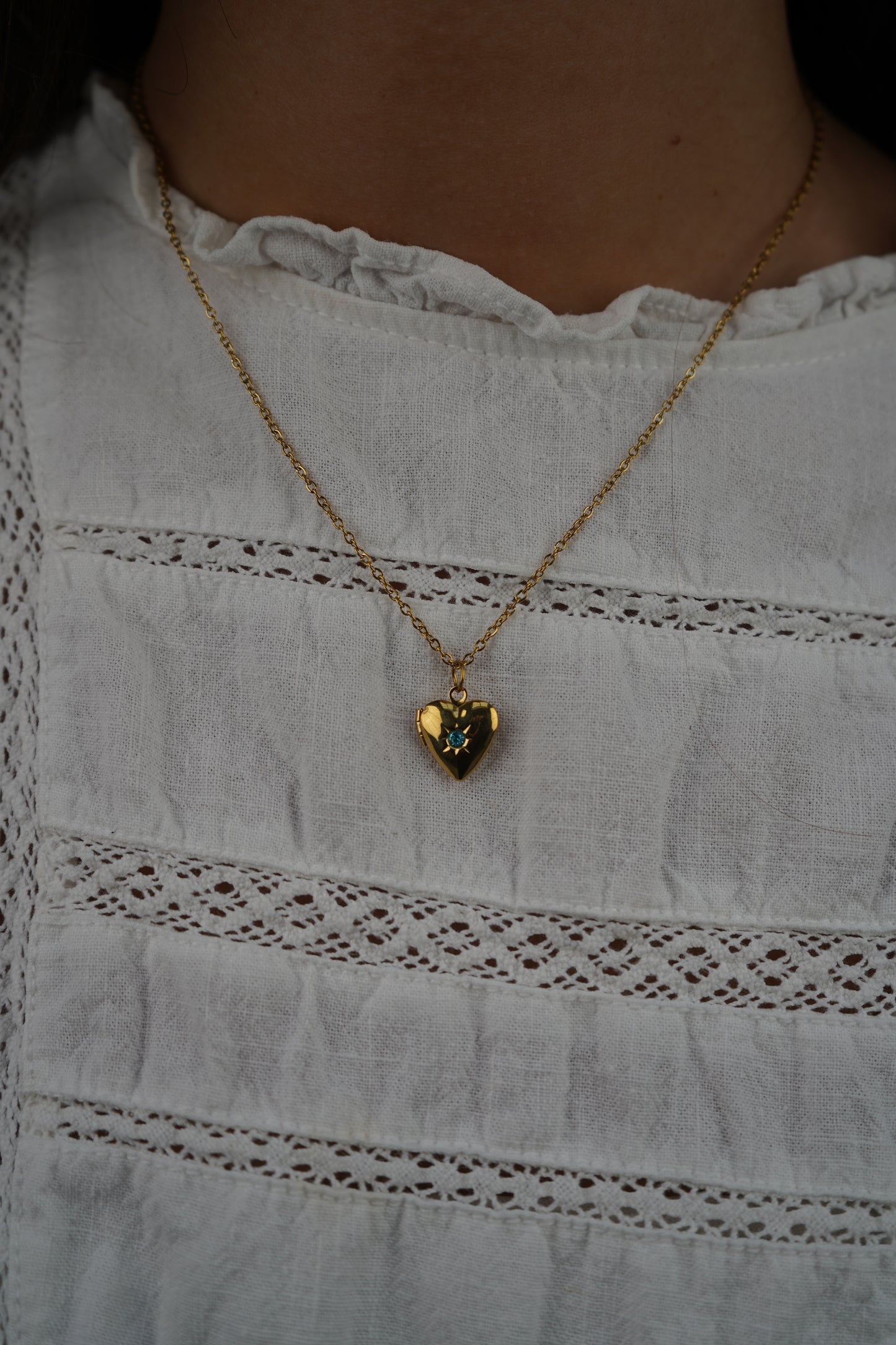 Tiana 's Light Blue Heart Locket