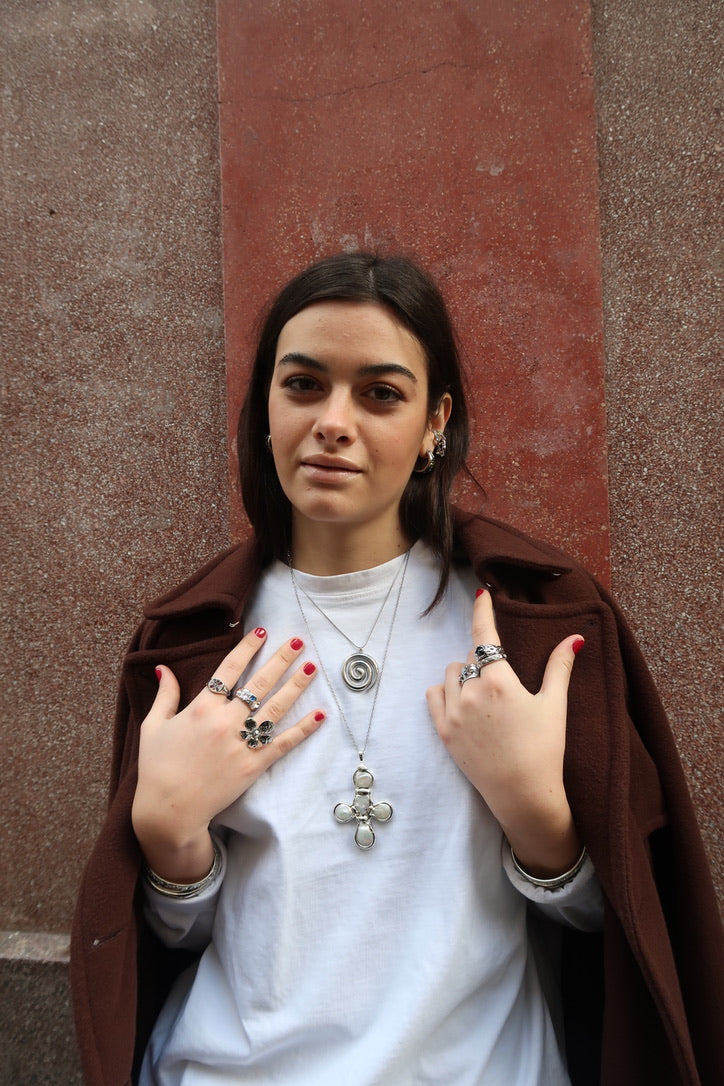 Daisy's silver cross necklace
