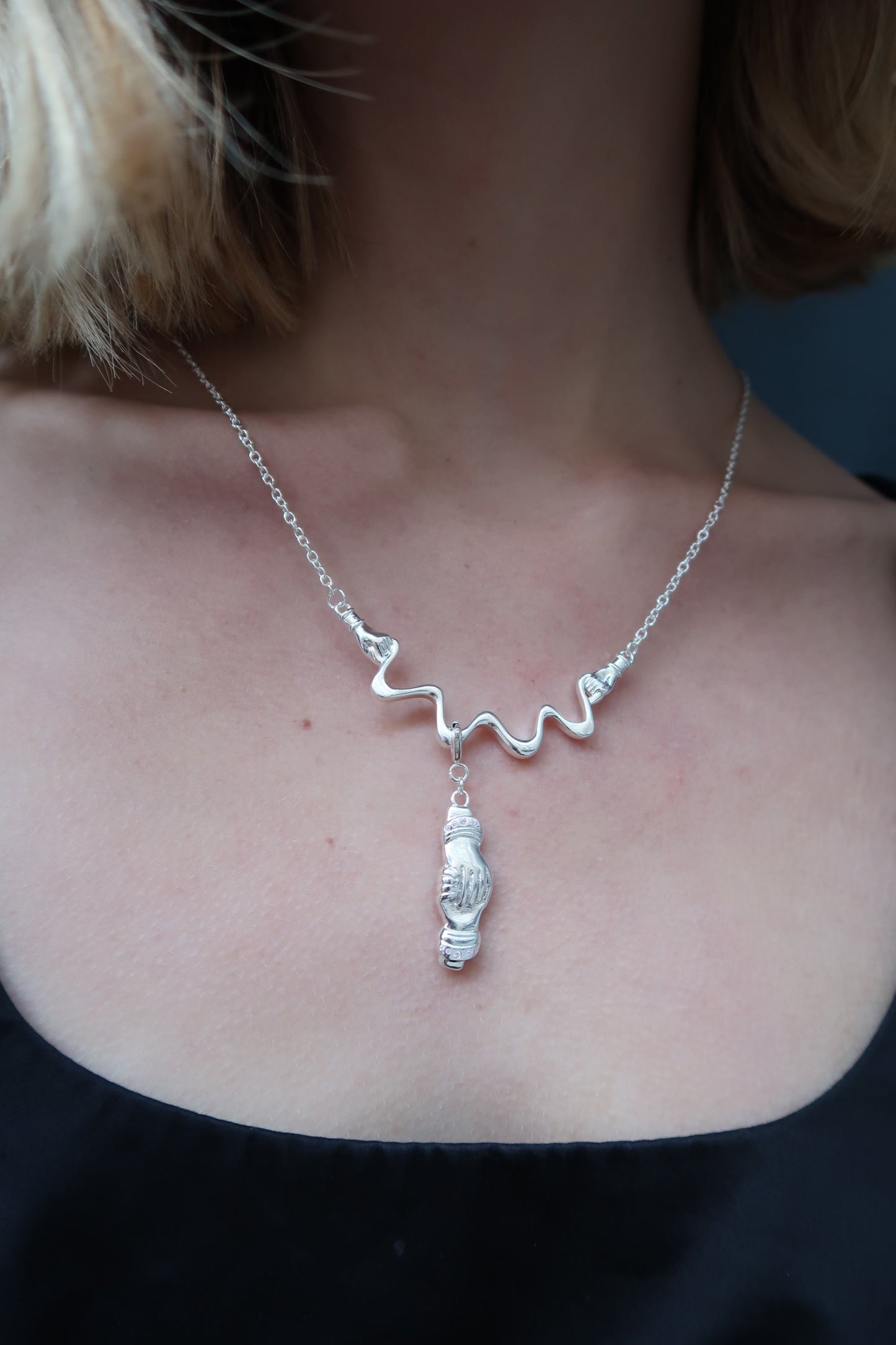 The strength charm in silver