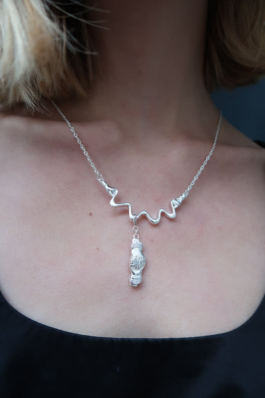 The strength charm in silver