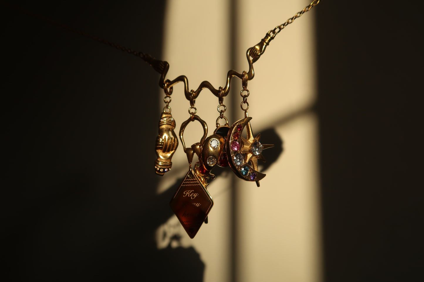 The Moon and Star Charm in gold