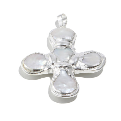 Daisy's silver cross necklace