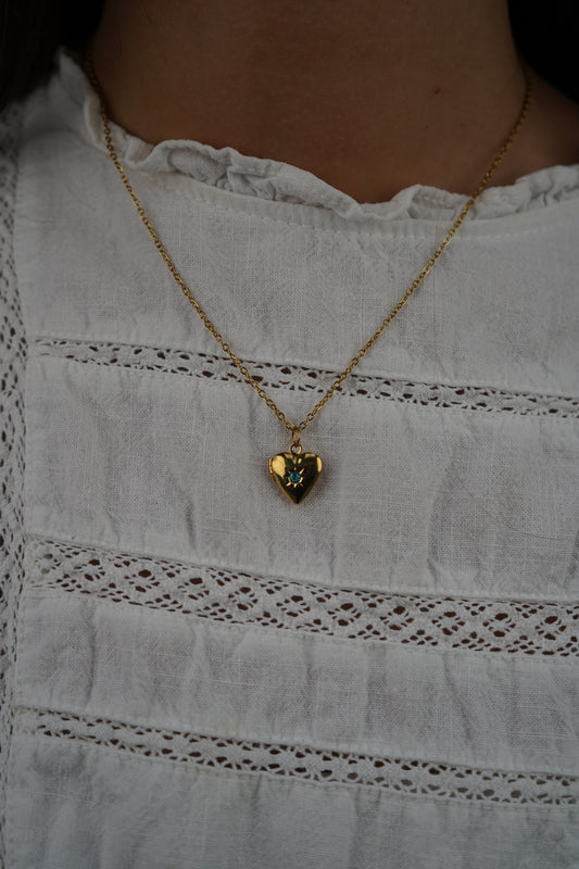 Tiana 's Light Blue Heart Locket