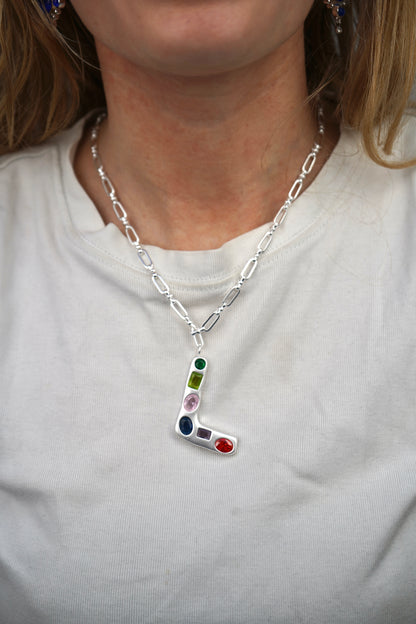The Gemstone Alphabet Pendant In Silver
