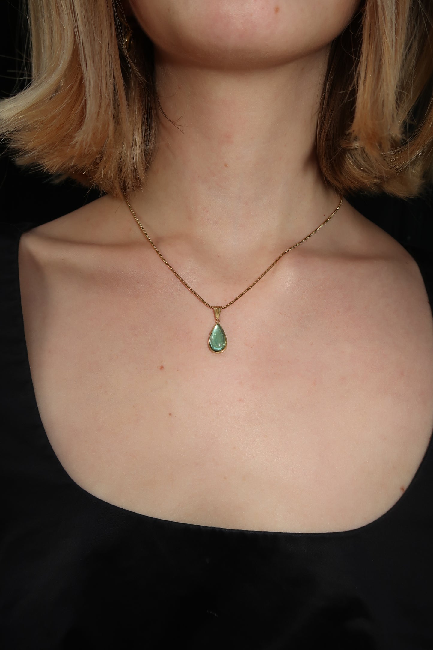 Thalia’s gemstone pendant