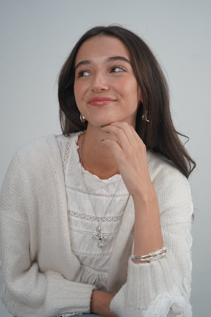 Daisy's silver cross necklaces