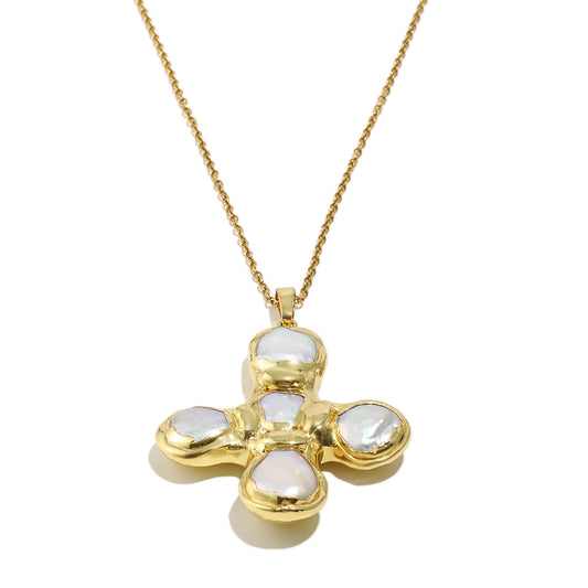 Daisy's gold cross necklace