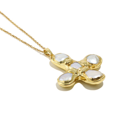 Daisy's gold cross necklace is