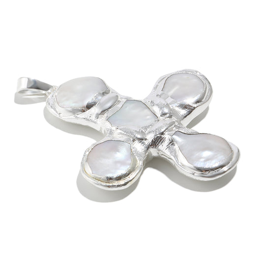 Daisy's silver cross necklace