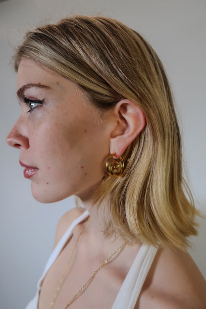 Tilly’s gold swirl earrings