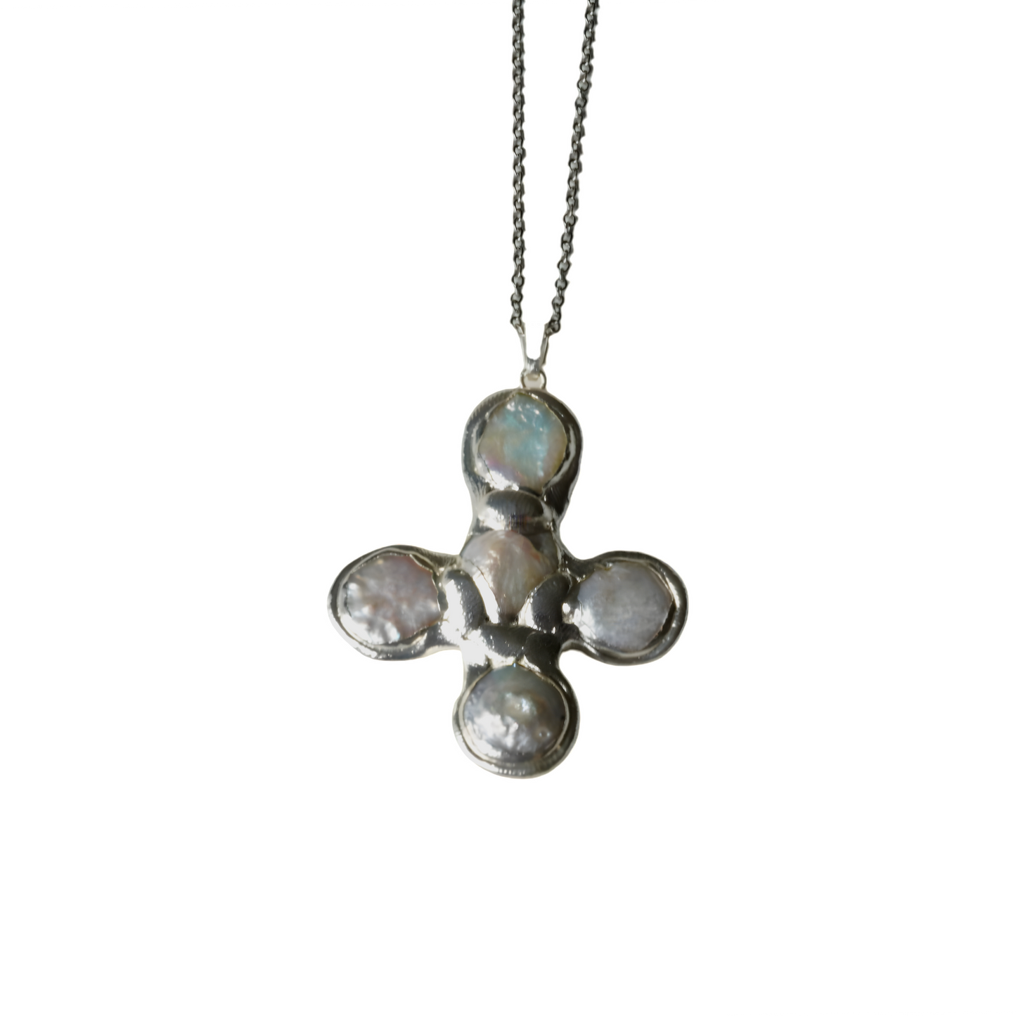 Daisy's silver cross necklace
