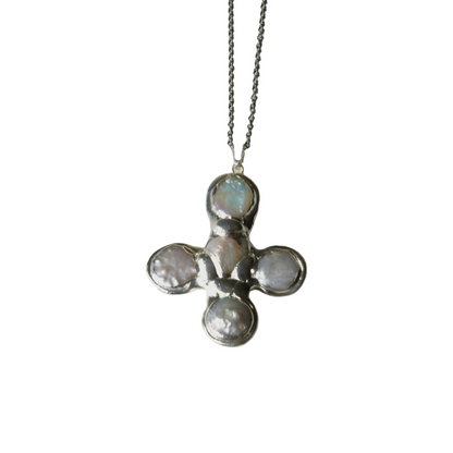 Daisy's silver cross necklace