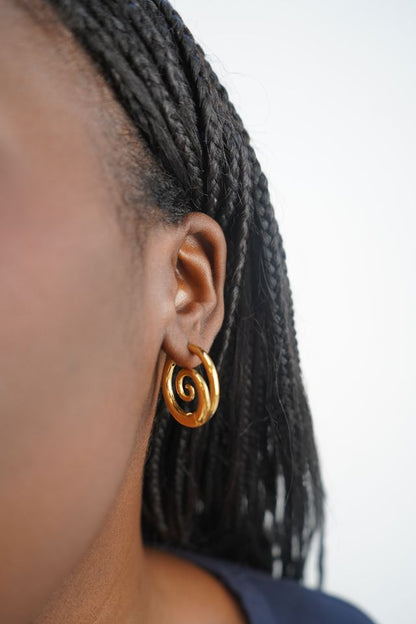 Tilly’s gold swirl earrings
