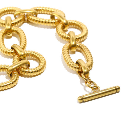 Thea’s gold bracelet