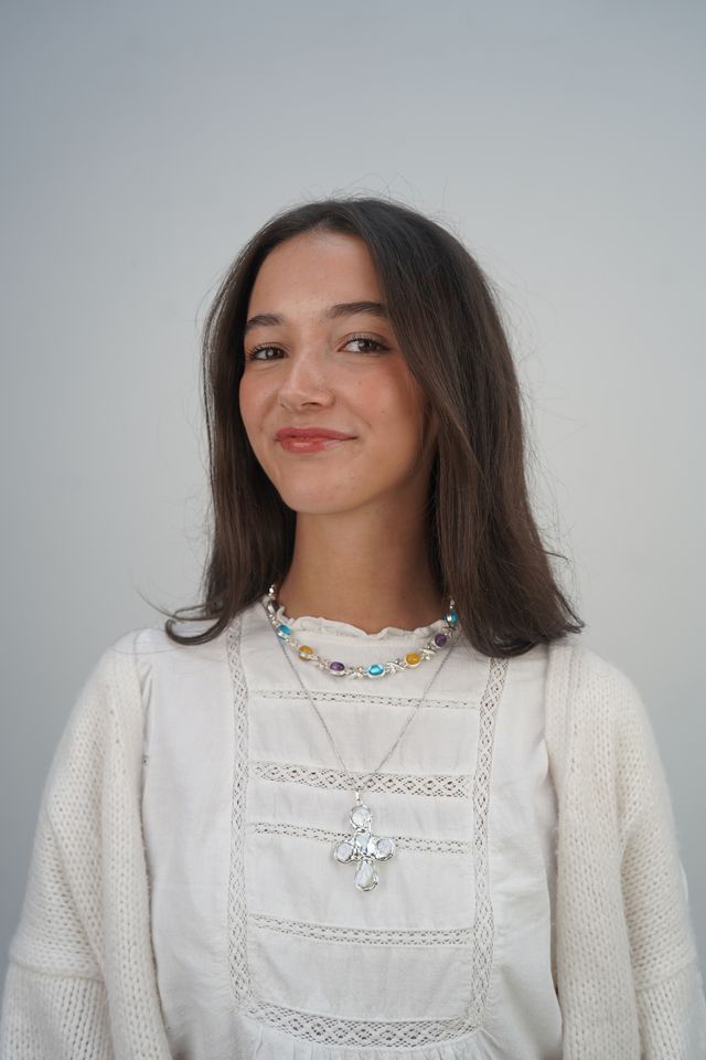 Daisy's silver cross necklaces